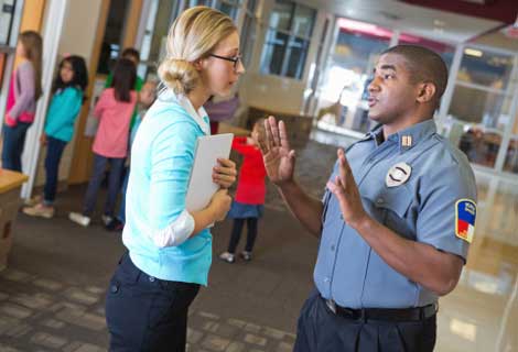 teacher communicting with police active shooter